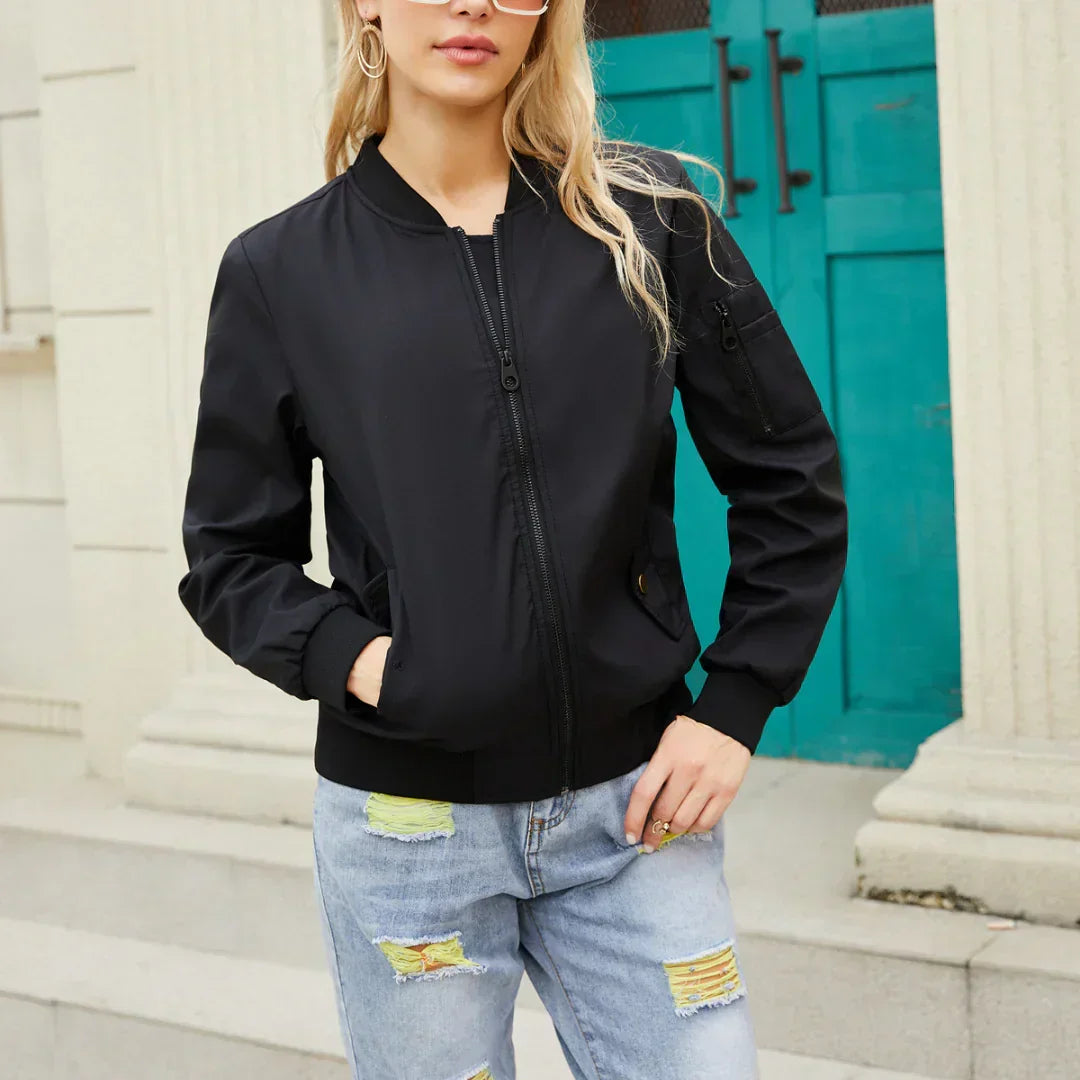Harlow casual bomber jacket in black, front view with hands in pockets