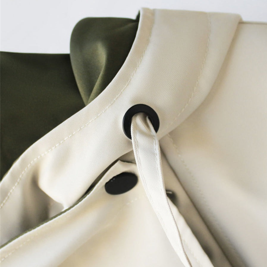 Close-up of Harlow jacket collar snap closure detail