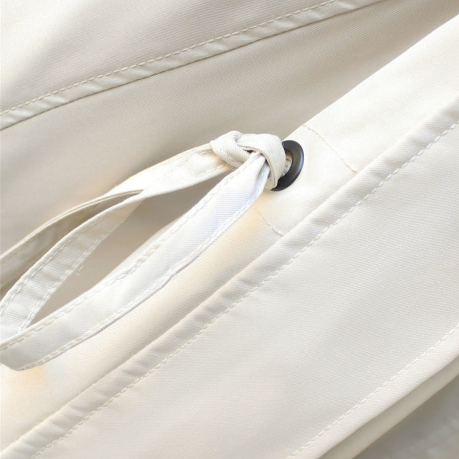Close-up of Harlow jacket drawstring tie and grommet detail