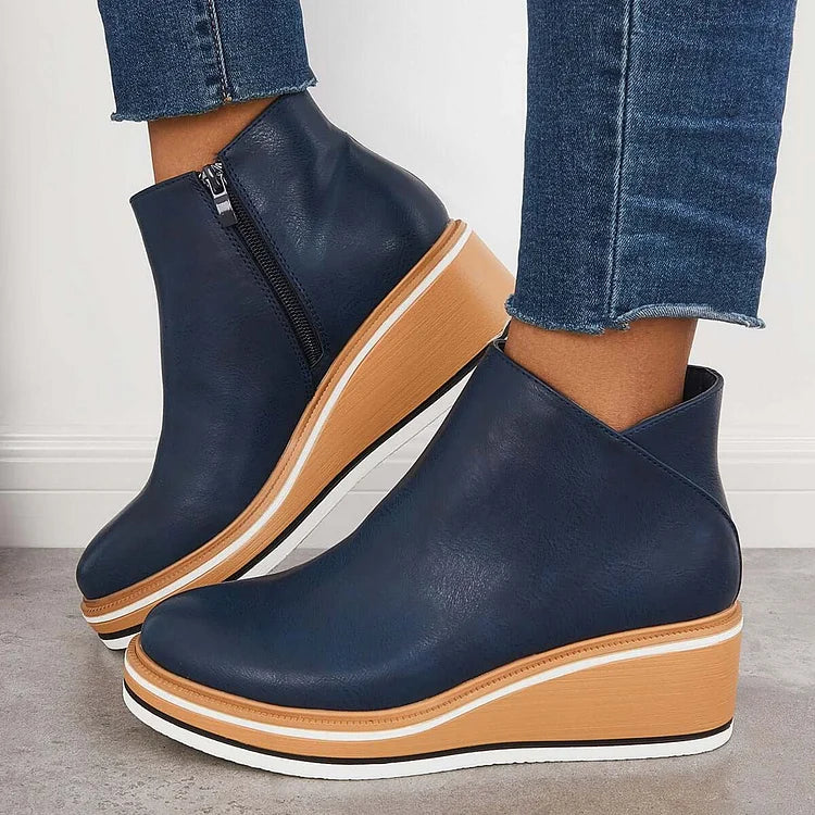 Harlow platform wedge ankle boots in navy, side view on model