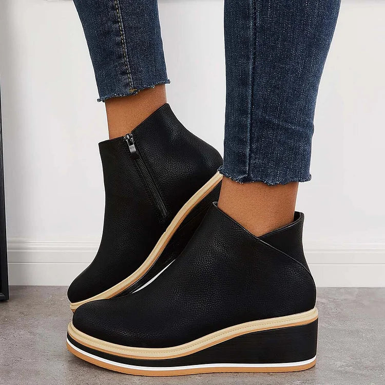 Harlow black ankle boots worn with jeans, side view