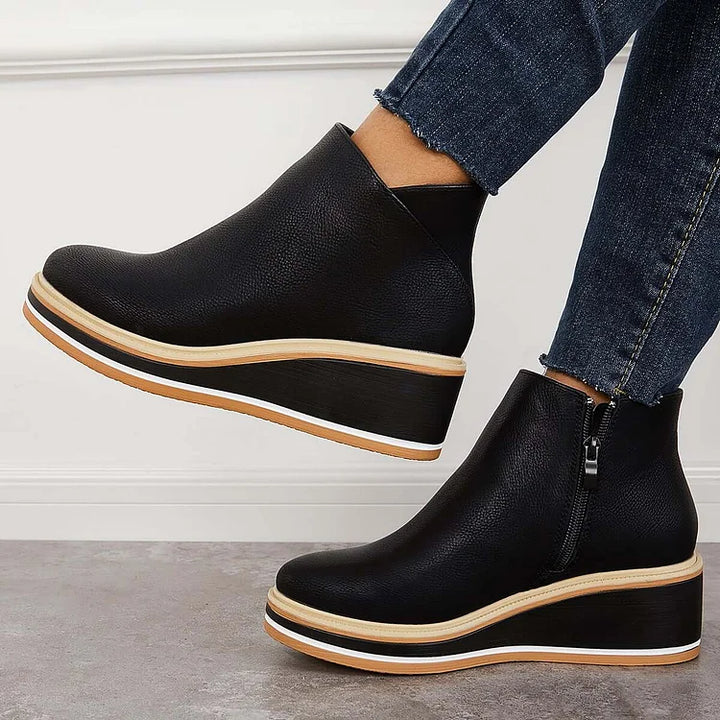 Harlow black wedge ankle boots side view raised heel