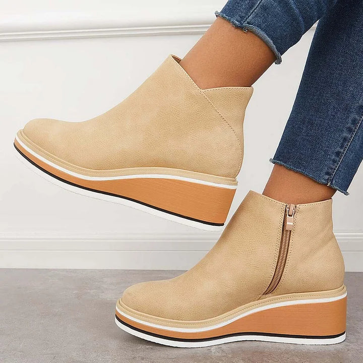 Harlow beige wedge boots side view with zipper detail