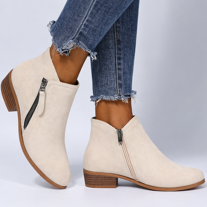 Harlow beige ankle boots with side-zip design, side profile view