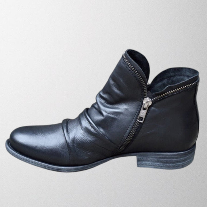 Harlow slouch zipper ankle boot in black, side view