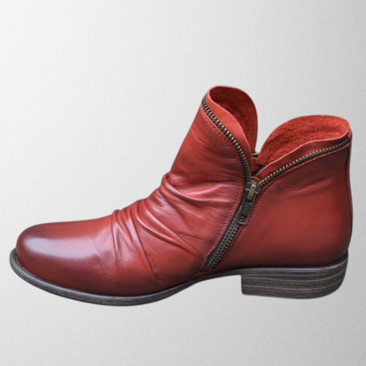Harlow slouch zipper ankle boot in red, side view