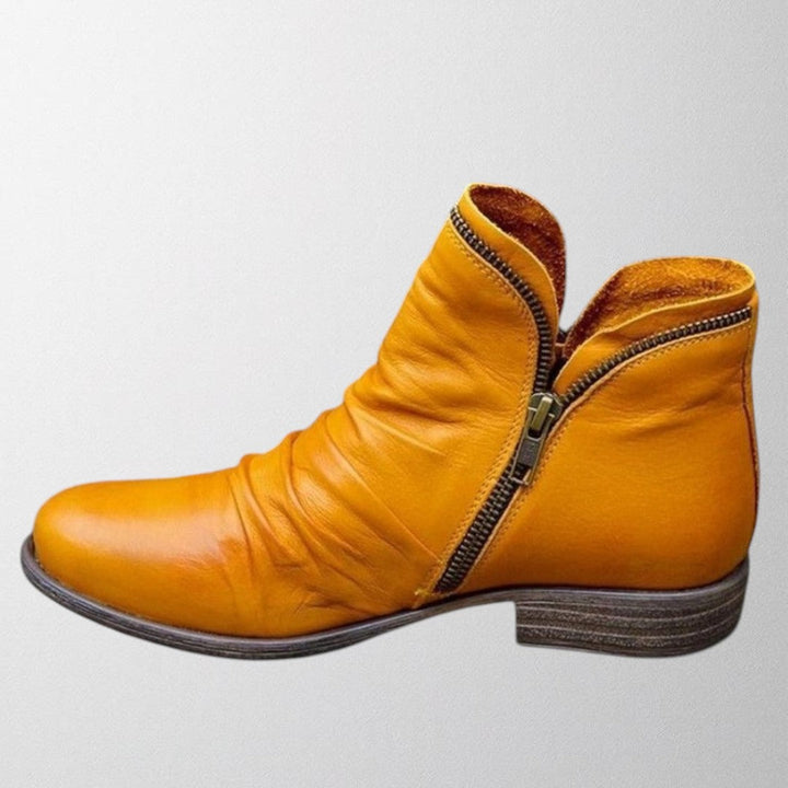 Harlow slouch zipper ankle boot in mustard yellow, side view