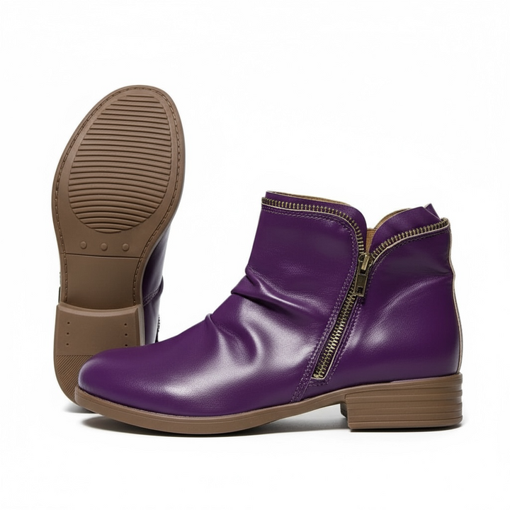 Harlow slouch zipper ankle boots in purple, back and sole view