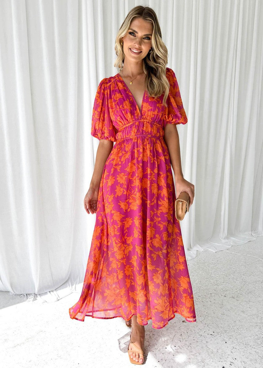 Isa floral V-neck maxi dress with puff sleeves, front view smiling