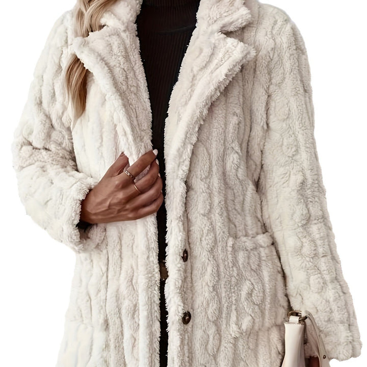 Isabeau teddy coat close-up showing button closure and textured fabric