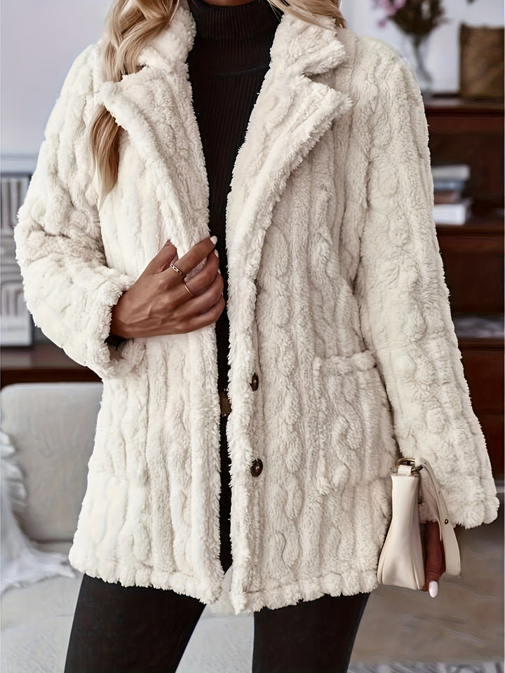 Isabeau teddy coat close-up detail with buttons and front pockets