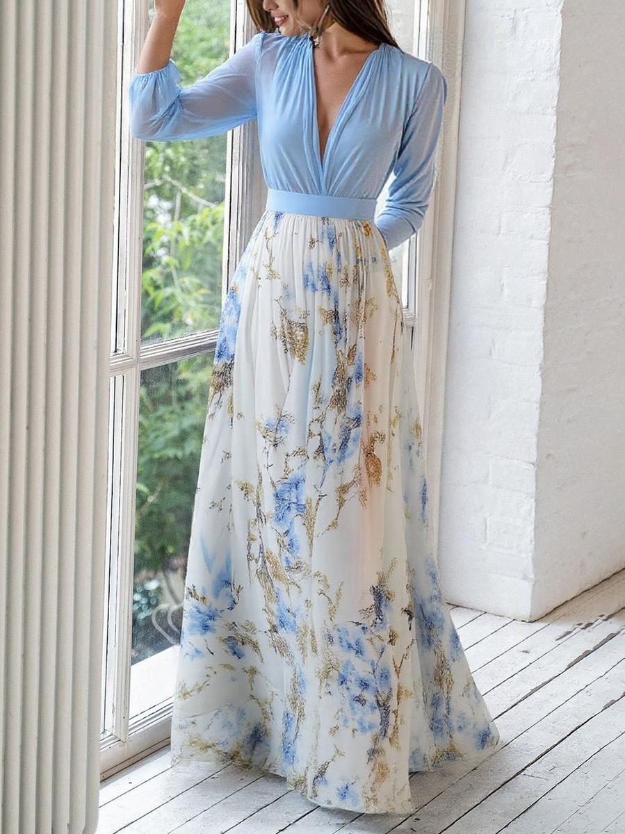 Isabella floral print maxi dress with long sleeves and flowing skirt, close-up view