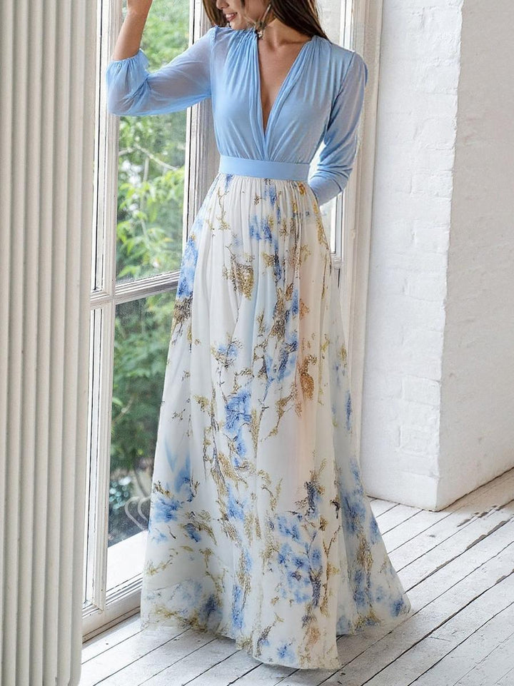 Isabella floral print maxi dress with long sleeves and flowing skirt, close-up view