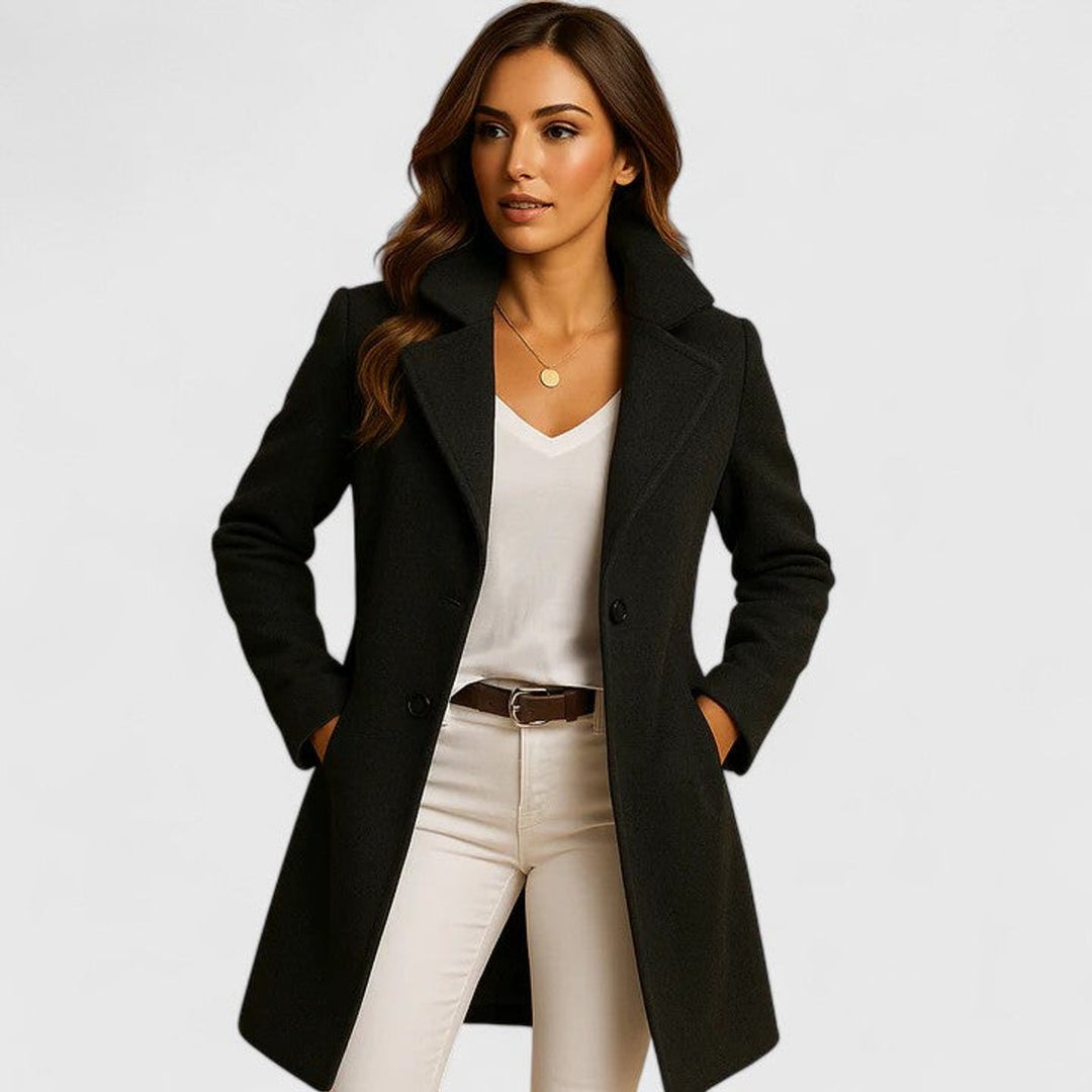 Isabelle notch-lapel double-breasted longline coat in black, front view with model