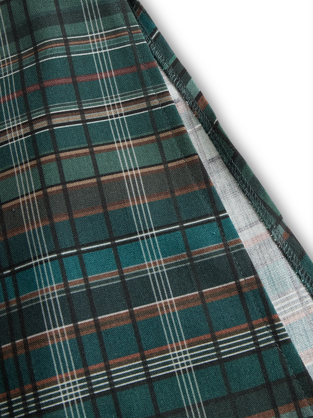Close-up of Josephine plaid fabric side seam detail