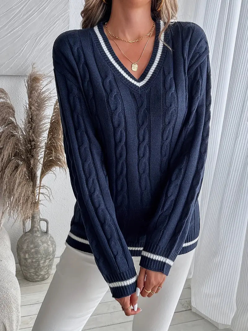 Juliette navy V-neck cable knit sweater, front styled with white jeans