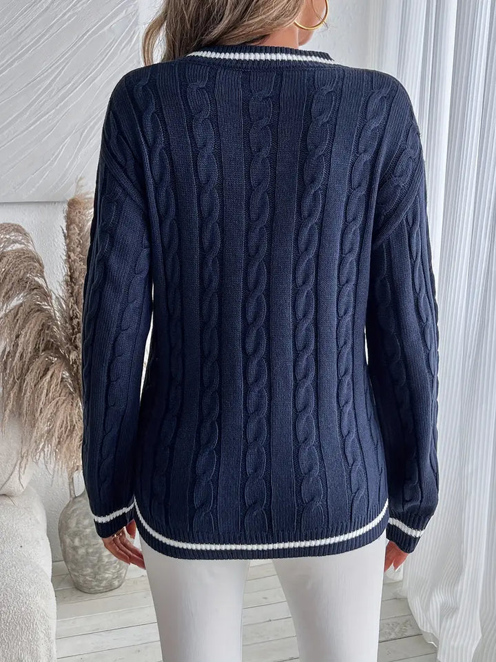 Juliette navy V-neck cable knit sweater, back view showing cable knit pattern