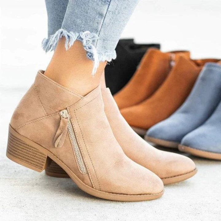 Juniper ankle boots in beige with zipper detail, front row with other colors