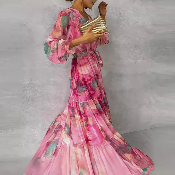 Katie floral wrap maxi dress side view showing flowing tiered skirt