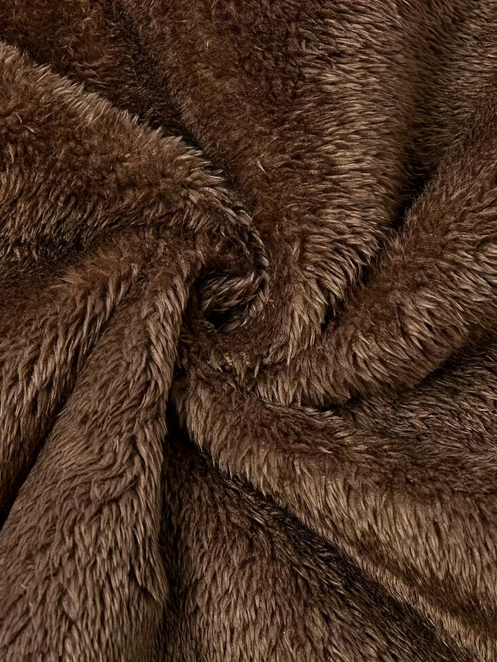 Close-up of Marcelline coat's deep front pocket with plush lining