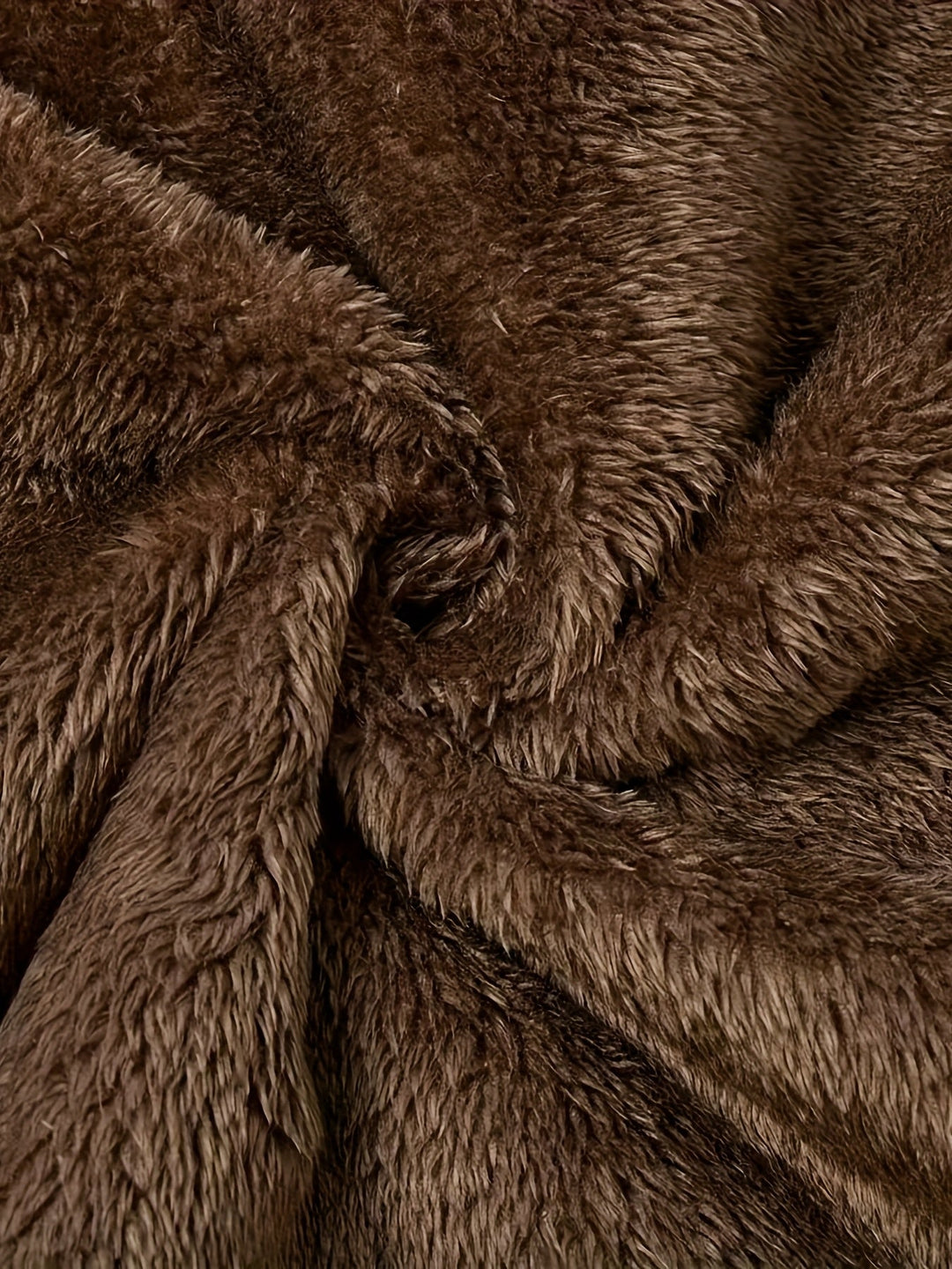 Close-up of Marcelline coat's deep front pocket with plush lining