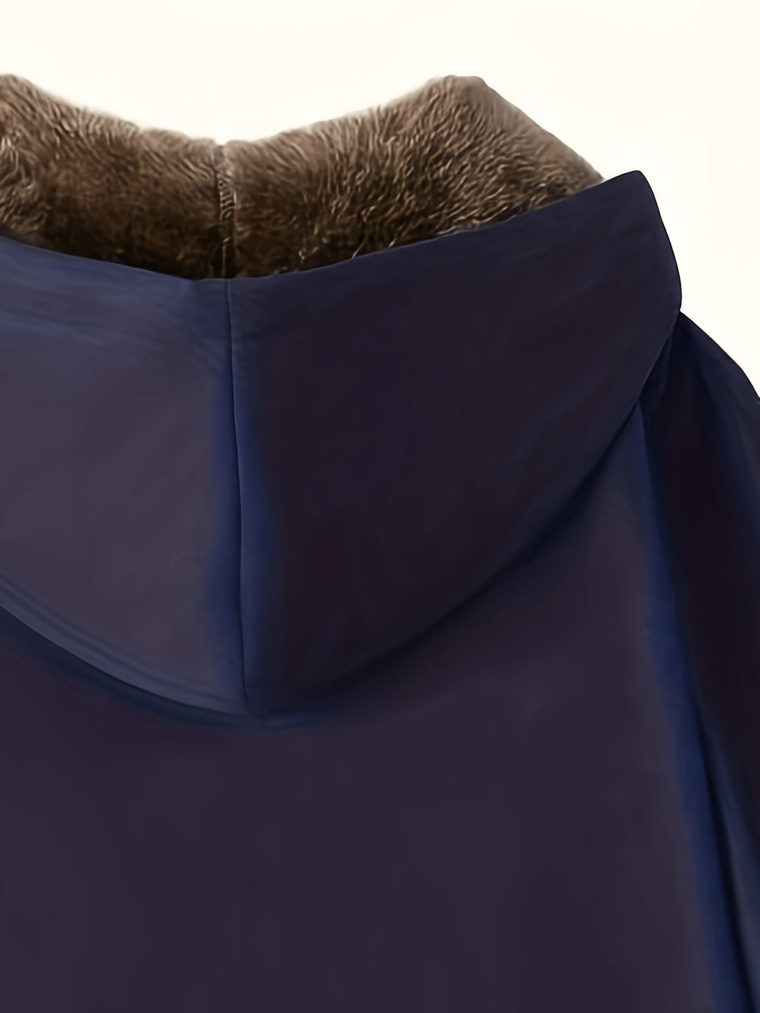 Close-up of Marcelline coat's deep front pocket with plush lining