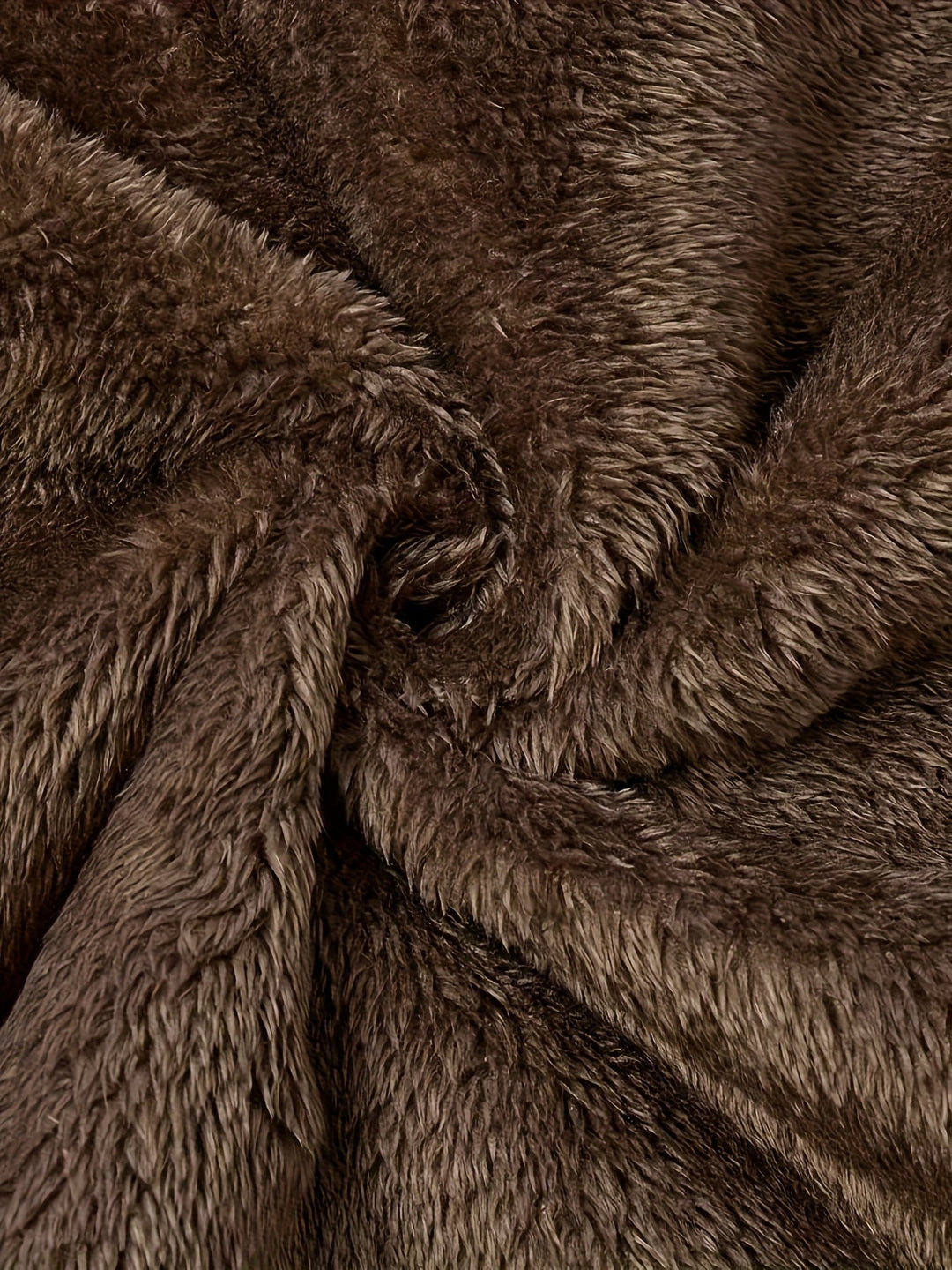Close-up of Marcelline coat's deep front pocket with plush lining