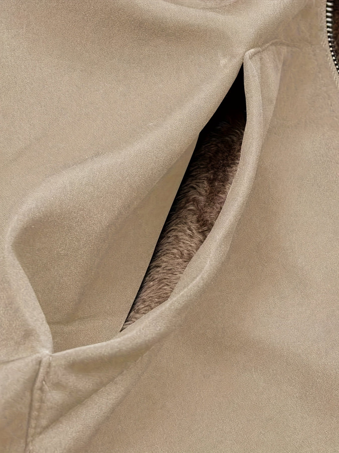 Close-up of Marcelline coat's deep front pocket with plush lining
