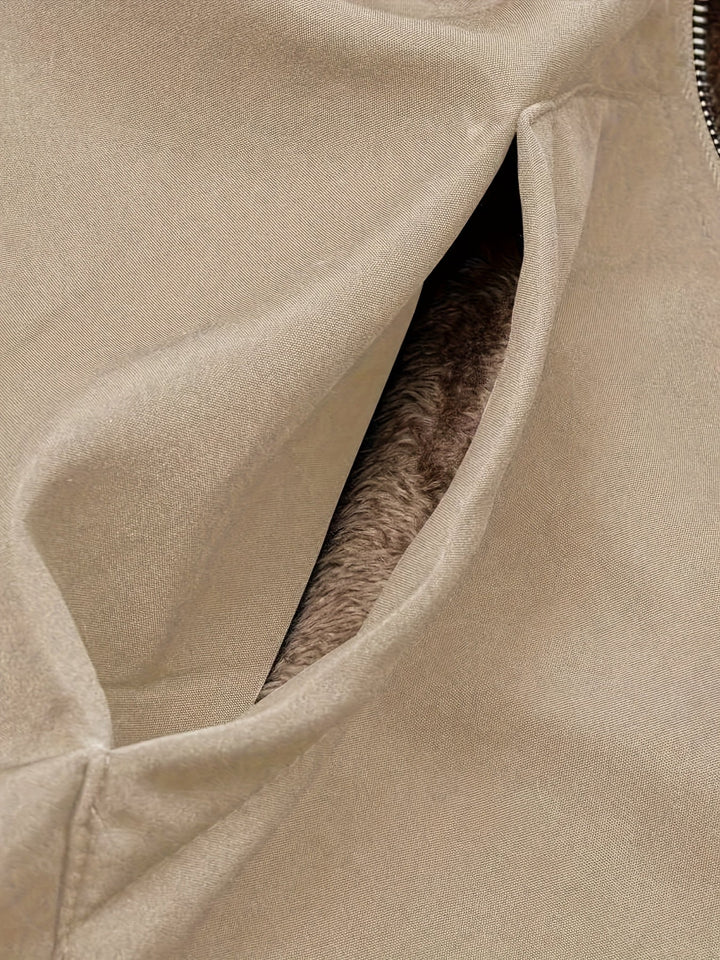 Close-up of Marcelline coat's deep front pocket with plush lining