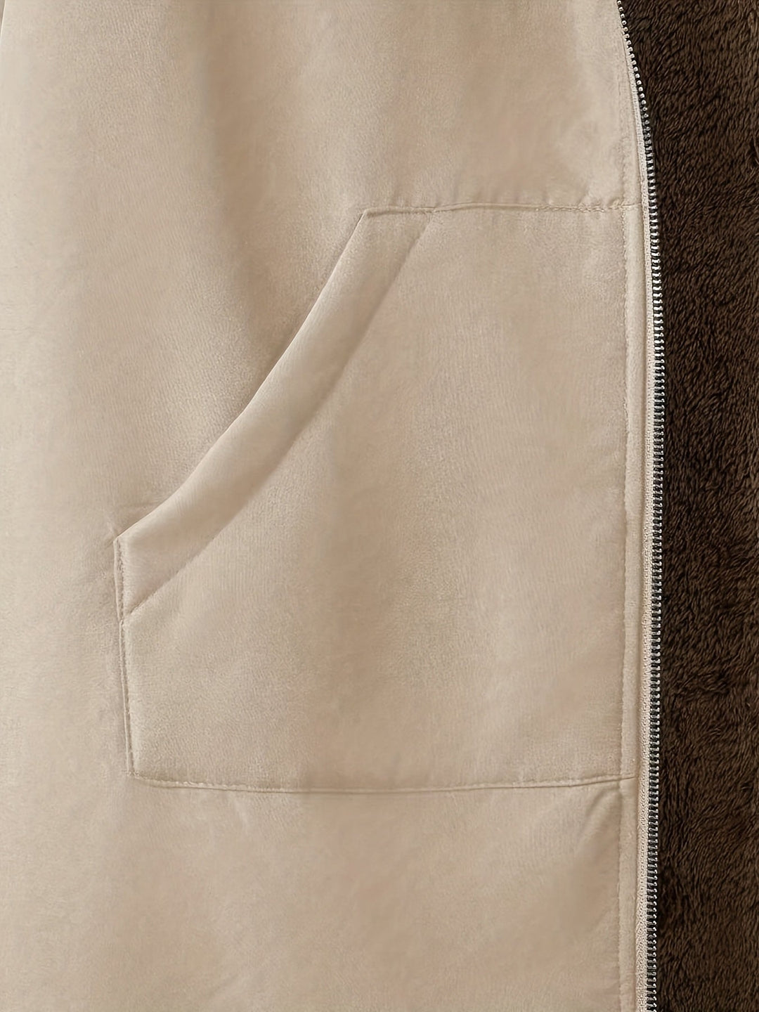Close-up of Marcelline coat's deep front pocket with plush lining