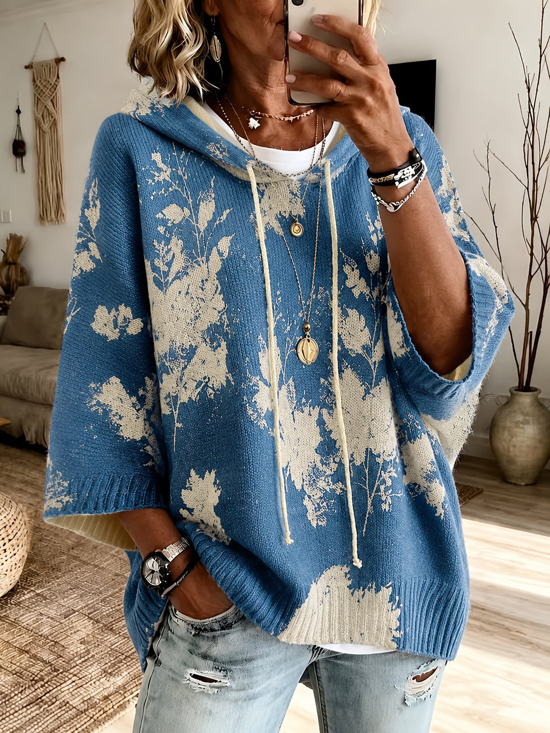 Marcelline hooded floral cape sweater, close-up of hood and sleeve
