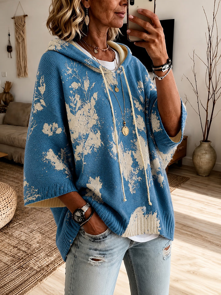 Marcelline hooded floral cape sweater, close-up of hood and sleeve