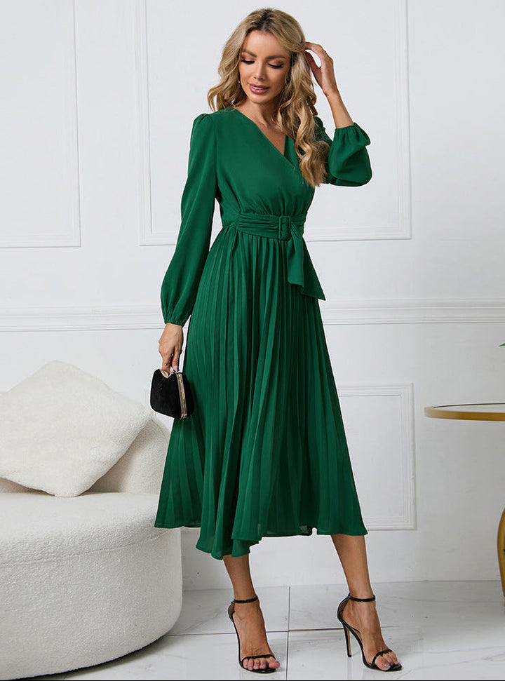 Margot pleated V-neck long sleeve midi dress in green, front view with belt and clutch