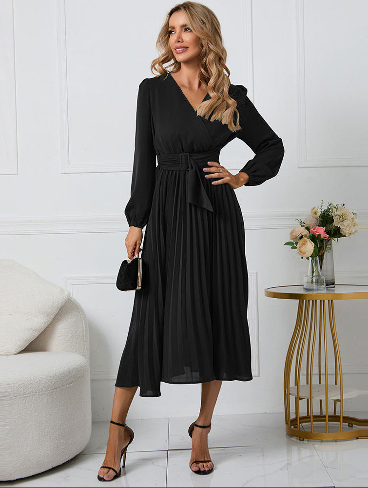 Margot pleated V-neck long sleeve midi dress in black, front pose with clutch