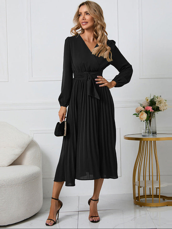Margot pleated V-neck long sleeve midi dress in black, front pose with clutch