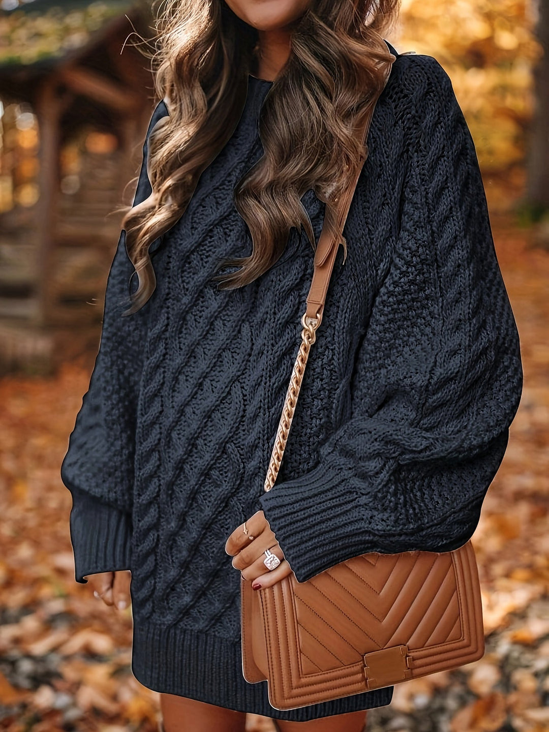 Marguerite sweater dress paired with brown crossbody bag, side view