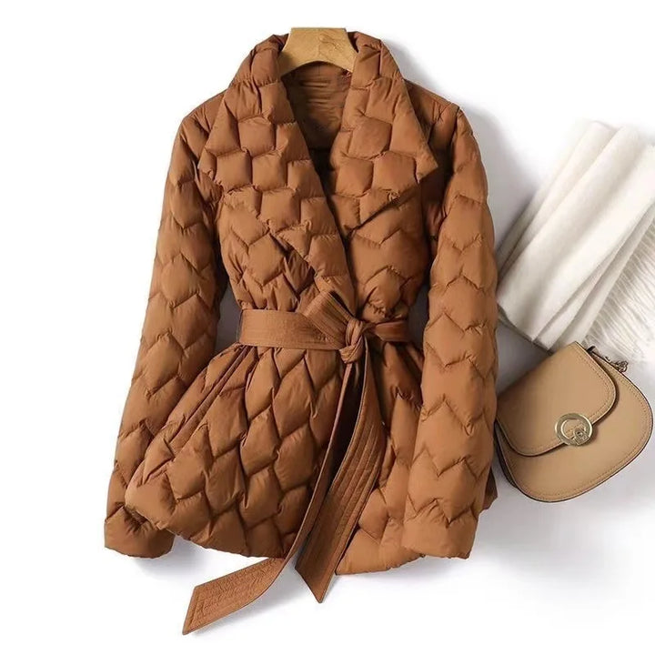 Marguerite quilted belted puffer jacket in caramel, front view on hanger with scarf and bag