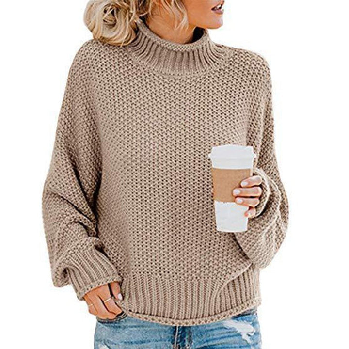 Marigold chunky knit turtleneck fall sweater in caramel, front view held with coffee cup