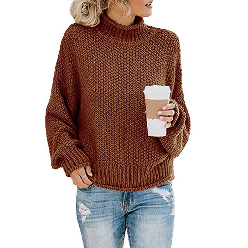 Marigold chunky knit turtleneck fall sweater in brown, front view held with coffee cup