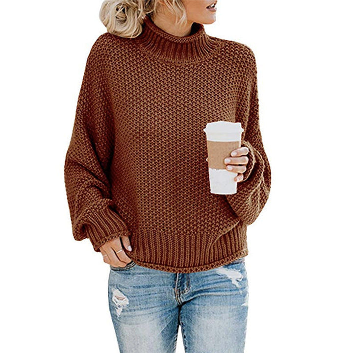 Marigold chunky knit turtleneck fall sweater in brown, front view held with coffee cup