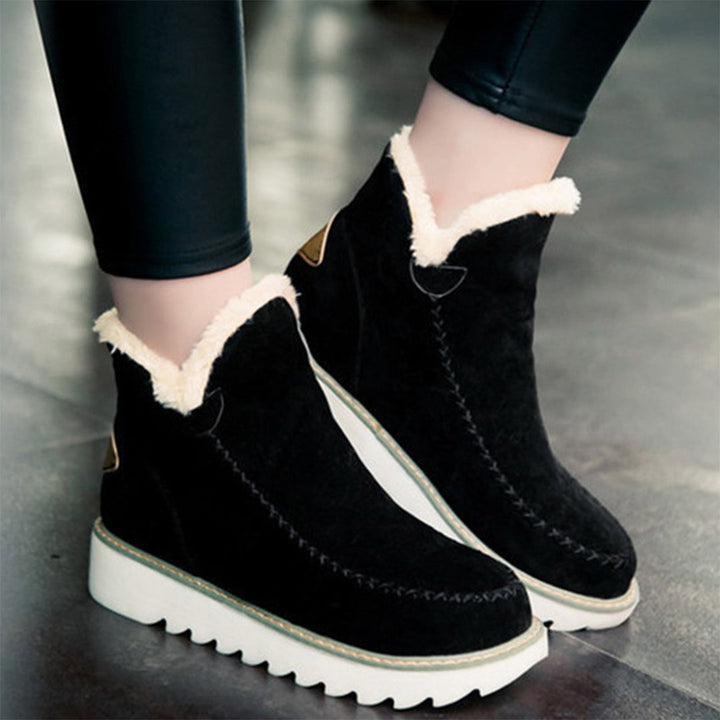 Marigold faux fur trim platform ankle boots, front view on model