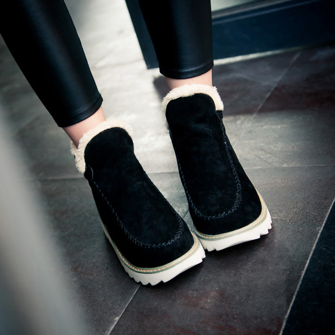 Marigold ankle boots, rear view on model