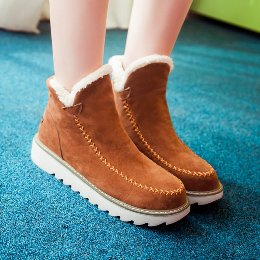 Marigold platform boots in tan, front angled view on model