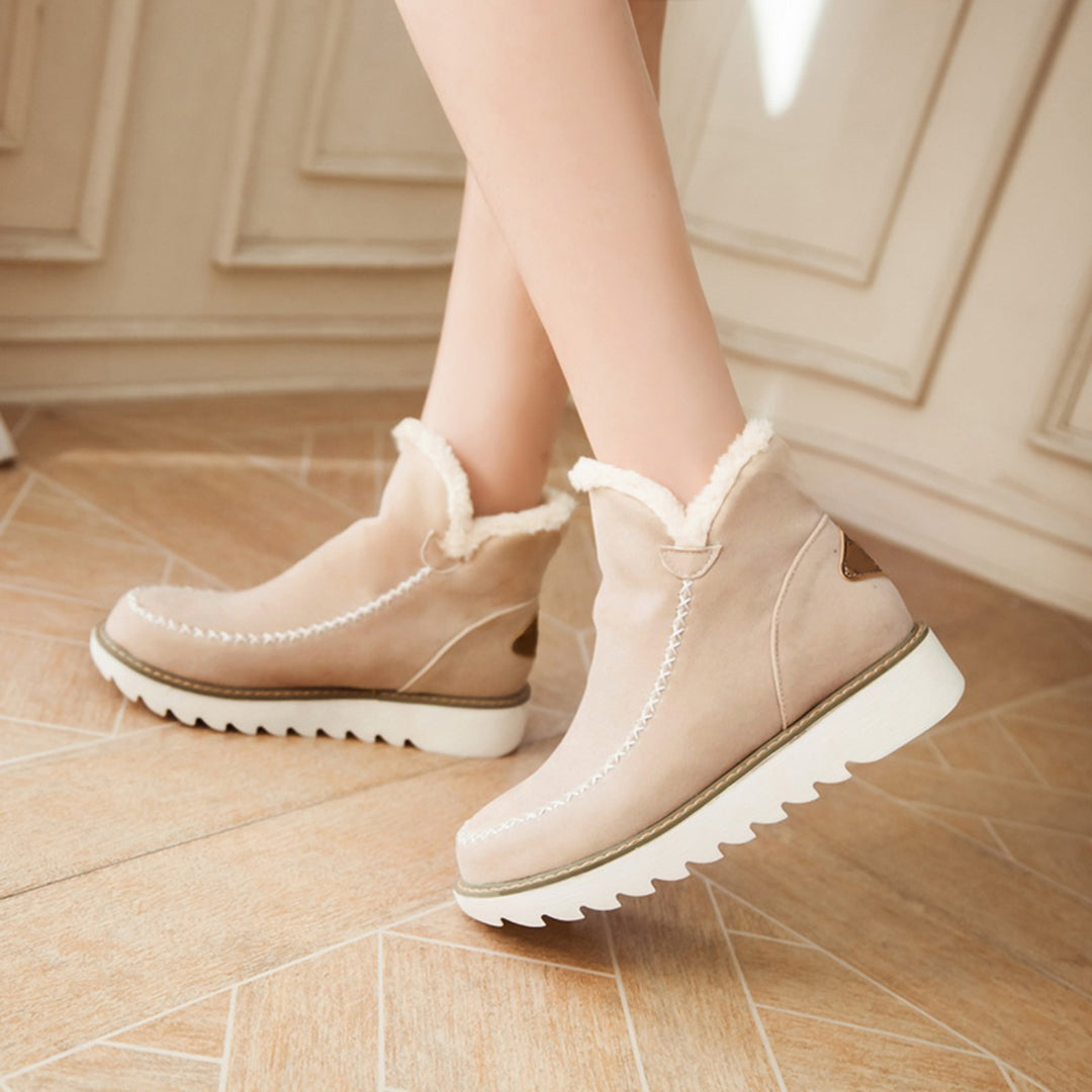 Marigold platform boots in tan, close-up on model