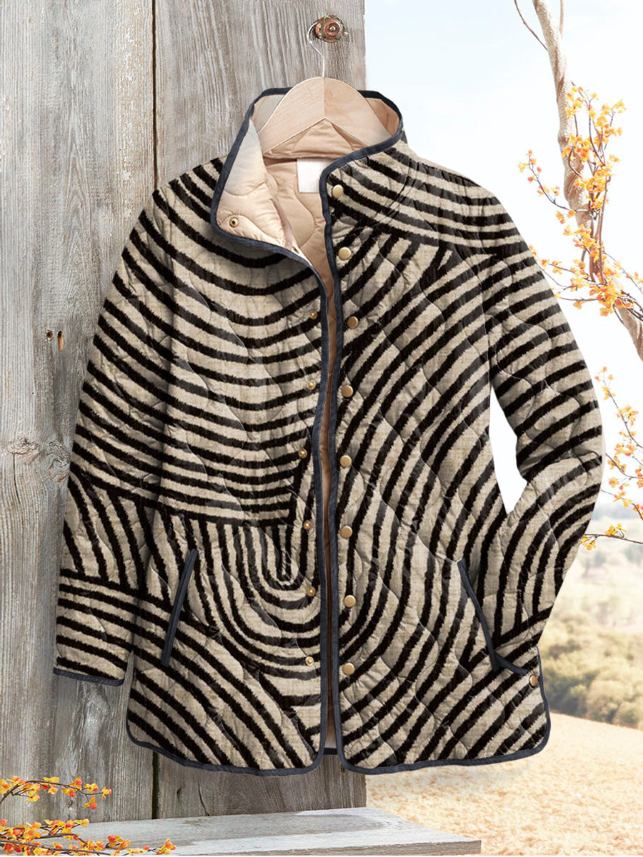 Marigold quilted jacket with hand-drawn circle print, front view on hanger
