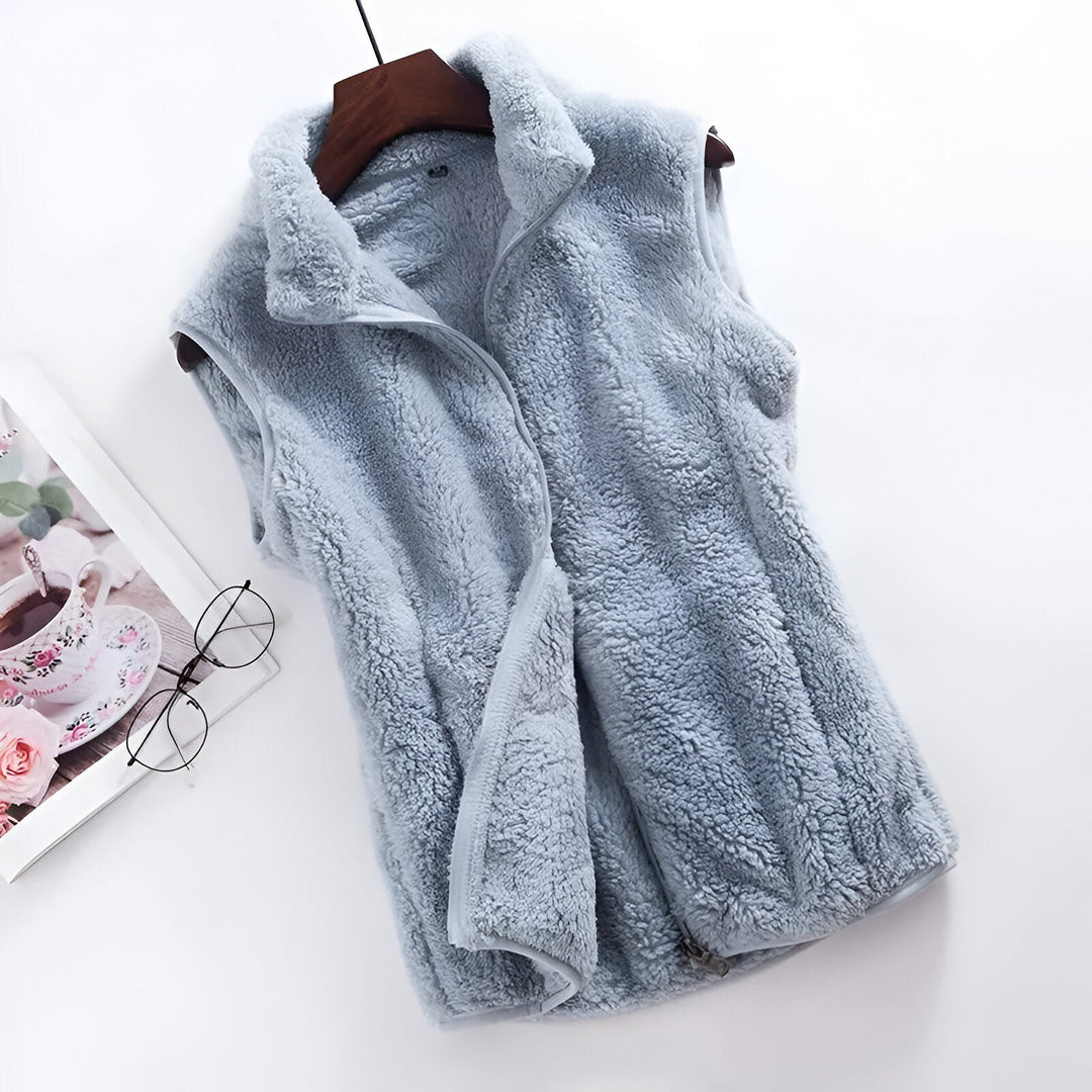 Marisela high collar sleeveless fleece vest in light blue, front view on hanger
