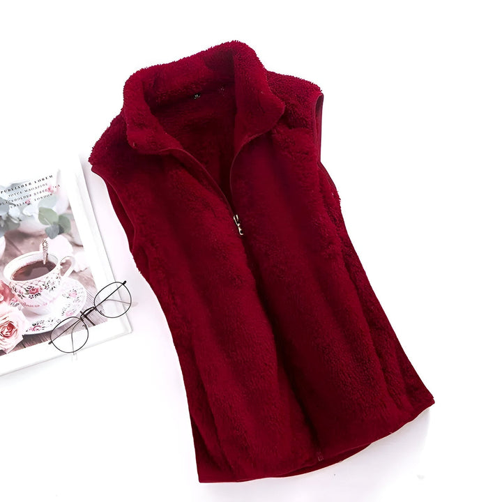 Marisela fleece vests folded and stacked in various colors