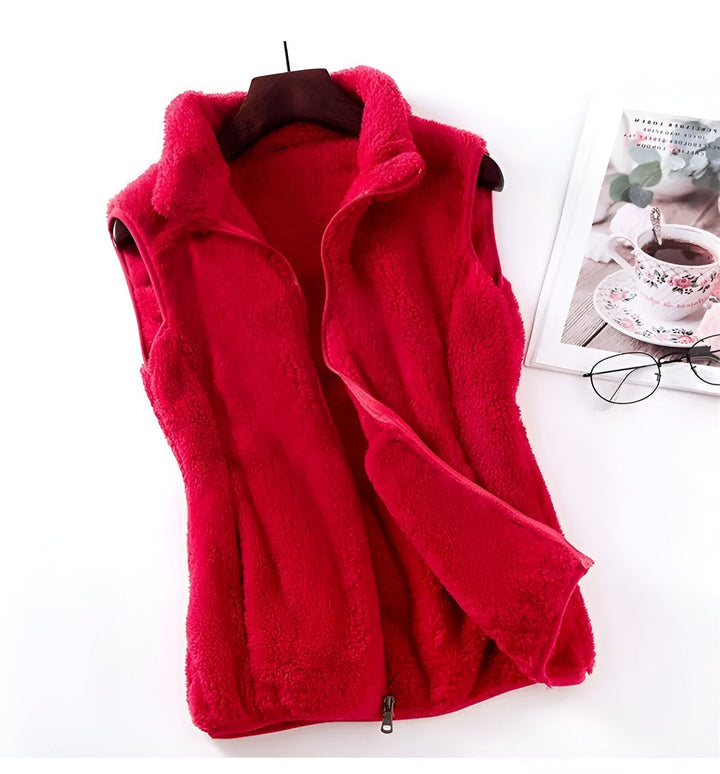 Marisela fleece vests folded and stacked in various colors
