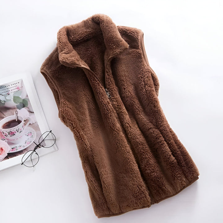 Marisela fleece vests folded and stacked in various colors