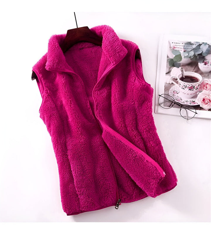 Marisela fleece vests folded and stacked in various colors